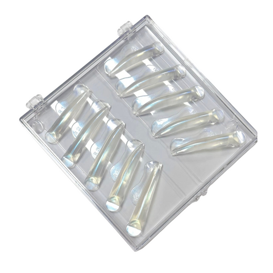 A clear plastic case containing multiple curved, translucent nail art tips or adhesive applicator tubes, shown on a plain white background.