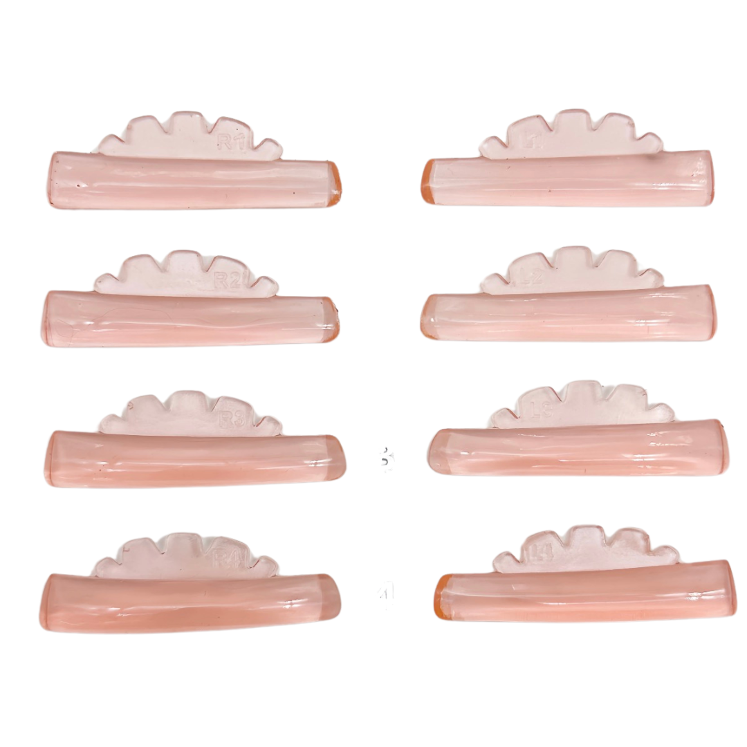 Eight pale pink hair claw clips arranged in two columns of four on a plain white background.