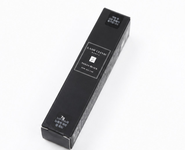 Four-panel product shot of a black cosmetic tube and its matching rectangular packaging on a white background, including a multi-pack display box and the applicator wand.