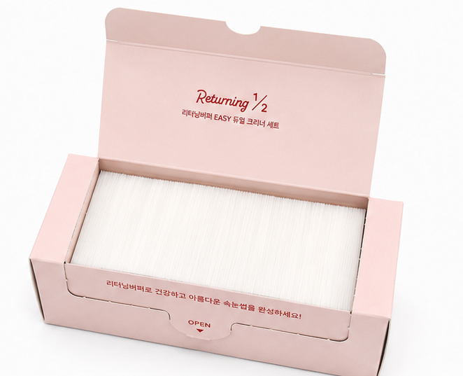 Four views of a light pink product box on a white background, showing the closed exterior, open exterior with white contents, open exterior with a separate insert, and the closed exterior from another angle. The box has red text reading 'Dreaming 1/2' and smaller Korean text.